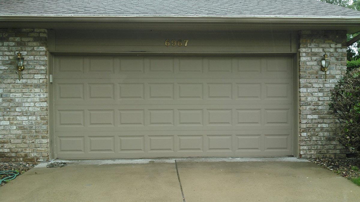 A garage door that is open and has the number 7 on it.